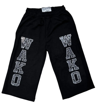 WAKO black cropped lounge shorts in heavyweight cotton with white topographic graphic print lettering on the legs.
